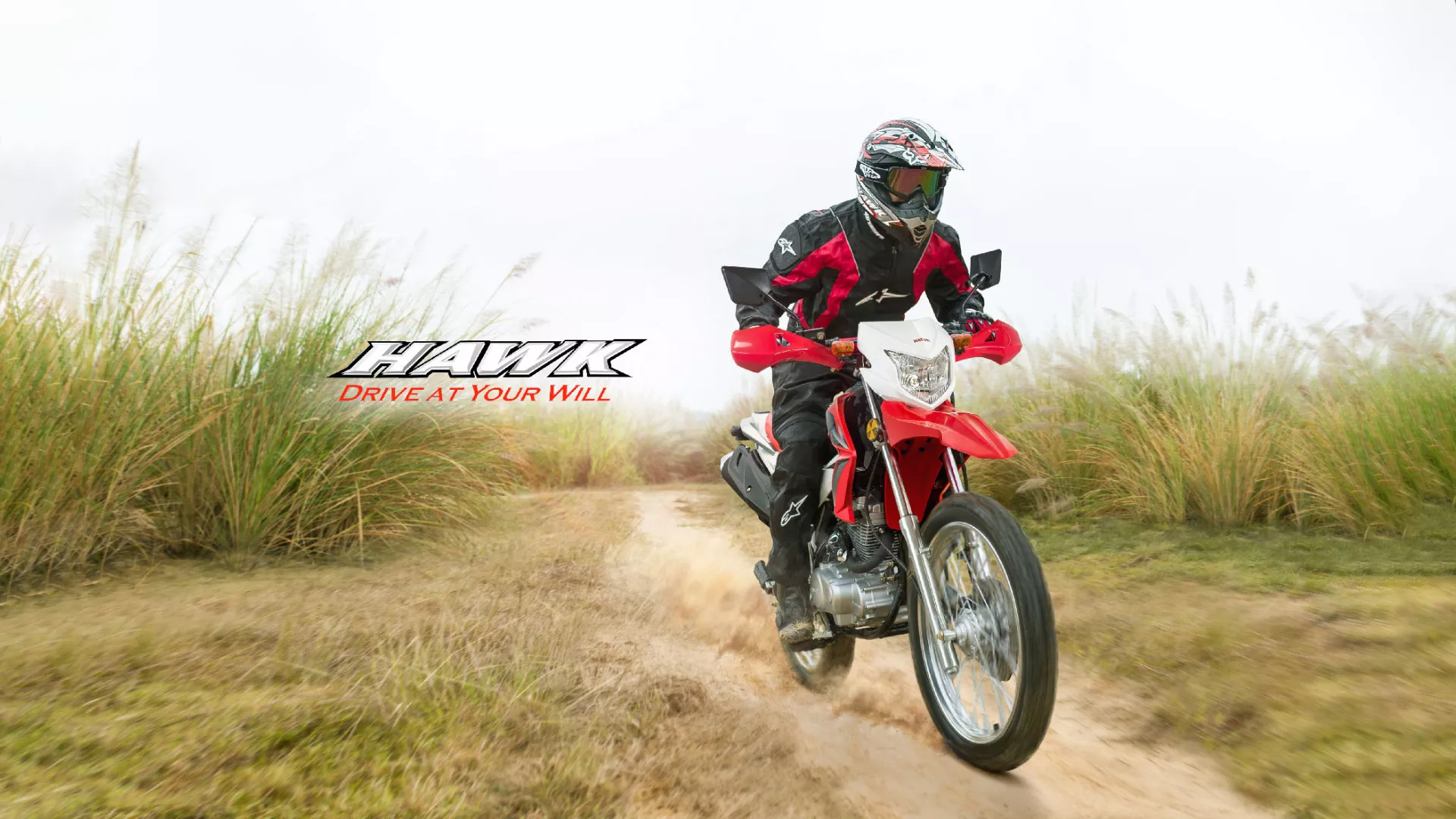 Man riding Hawk motorbike on a terrain